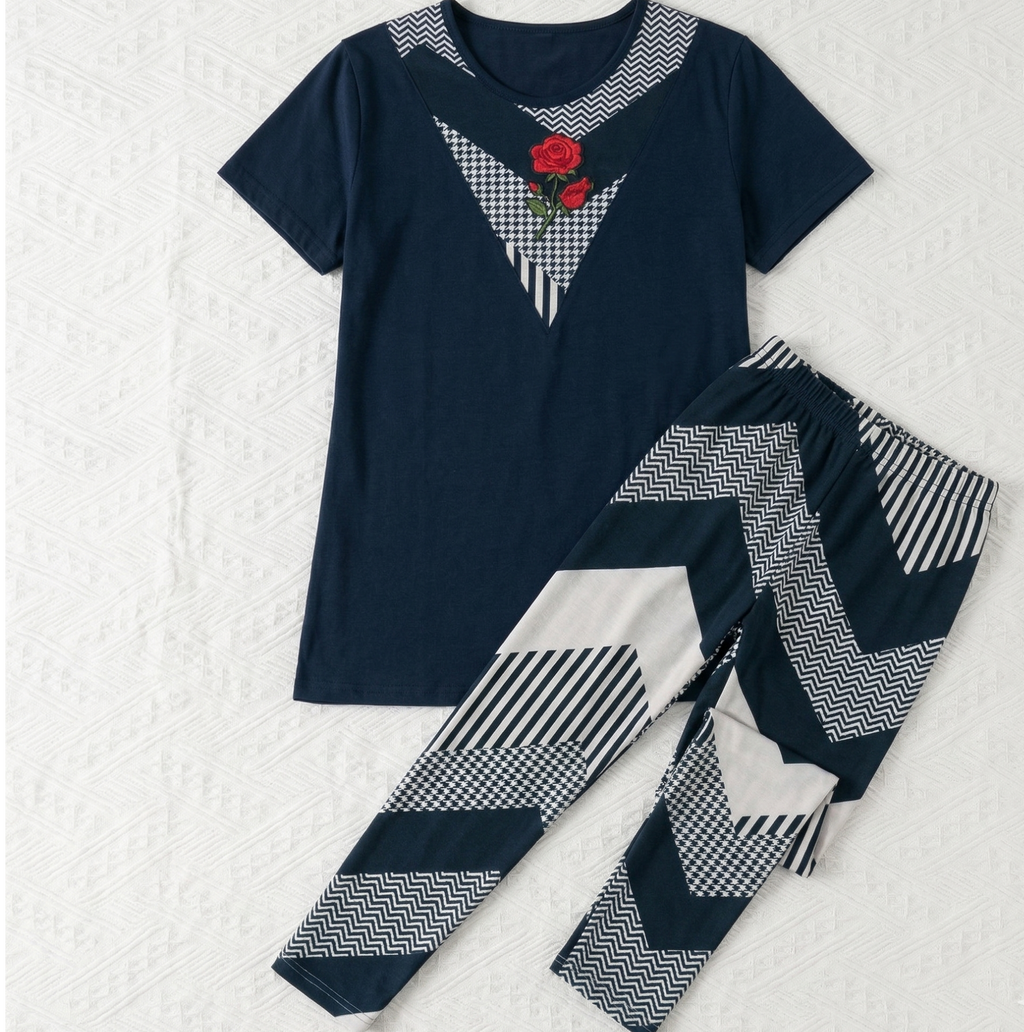 Navy blue pajama set with geometric patterns on a white background